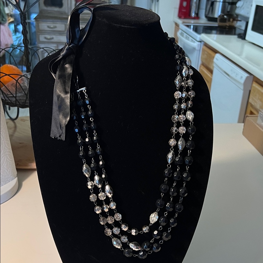 Elegant Three-Strand Black and Silver Beaded Necklace with Satin Tie